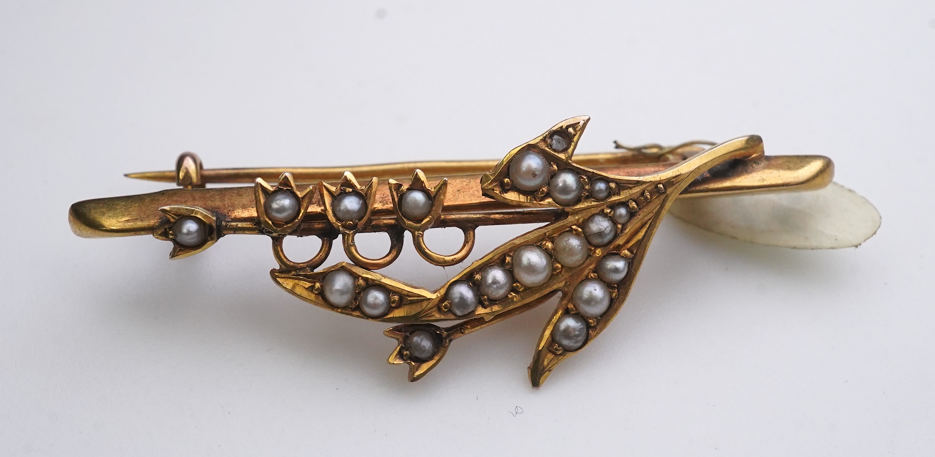 A collection of three late Victorian/Edwardian seed pearl brooches, circa 1900